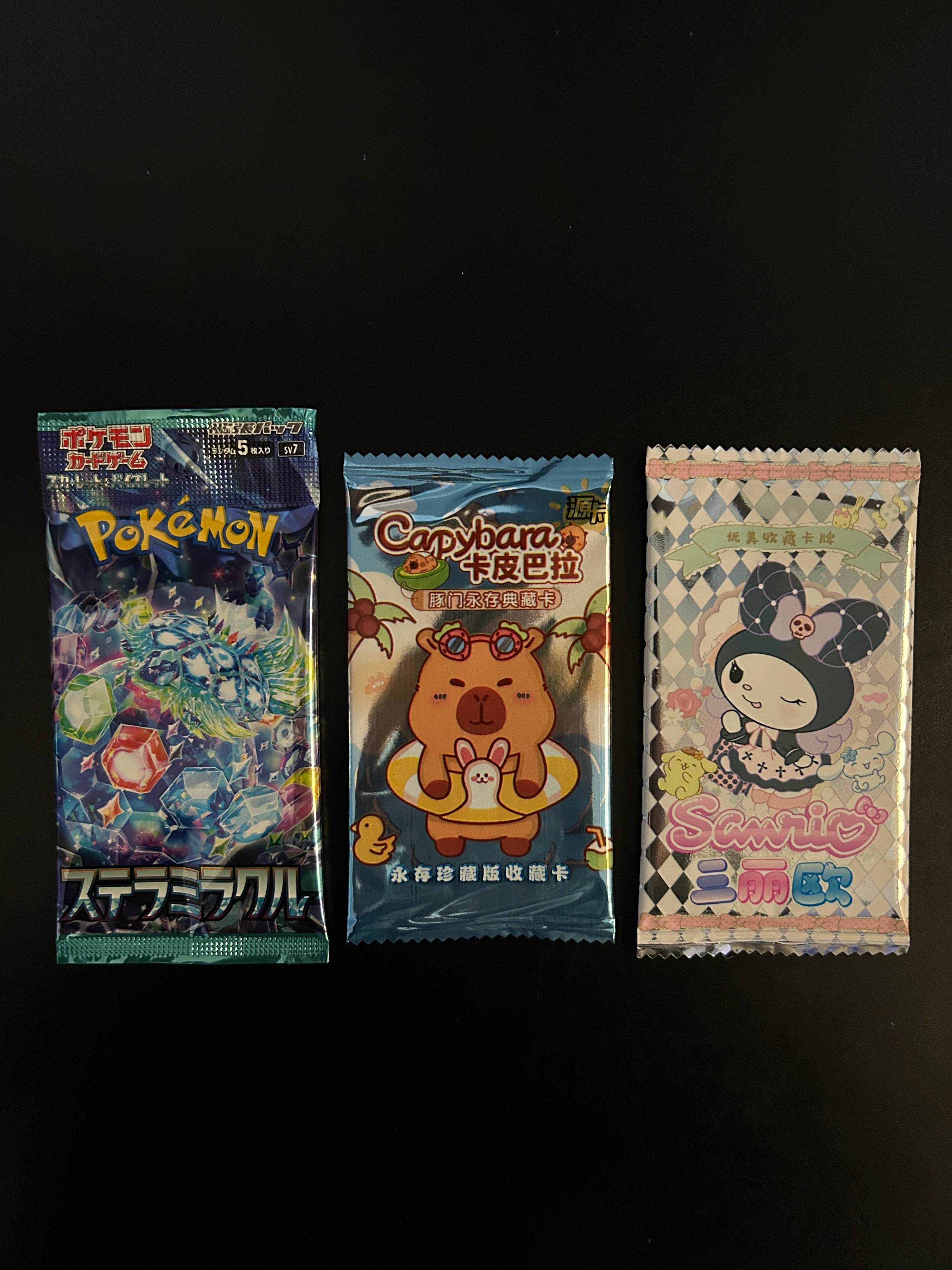($1.65) 12 Packs - Pokemon, Capybara & Sanrio Trading Card Packs